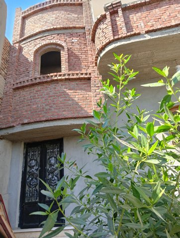 Unfurnished Two-Story Apartment Building for Sale in Memnon, Luxor West Bank – Investment Opportunity with Garden